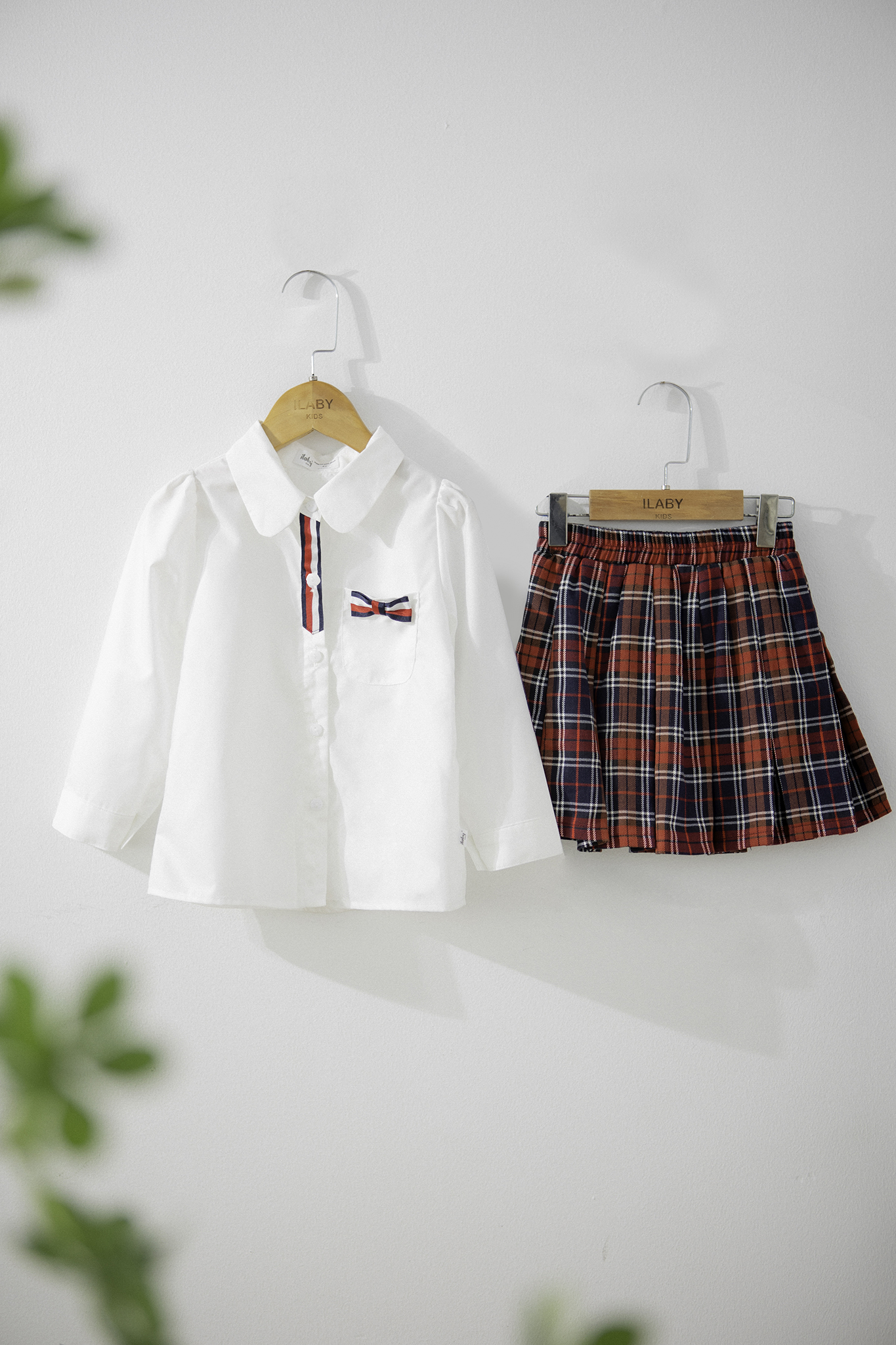 Áo sơ mi phối dây nơ túi